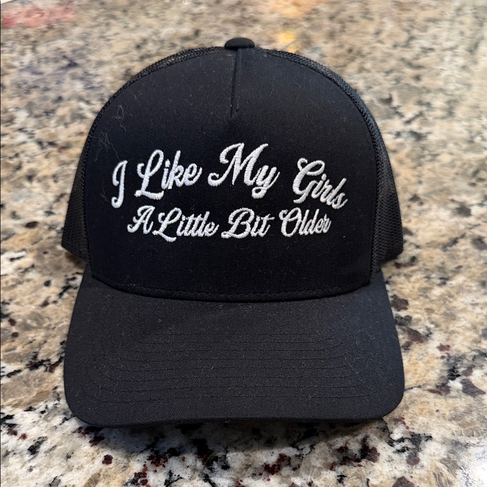 YUPOONG Black Embroidered Trucker Hat - "I Like My Girls A Little Bit Older"